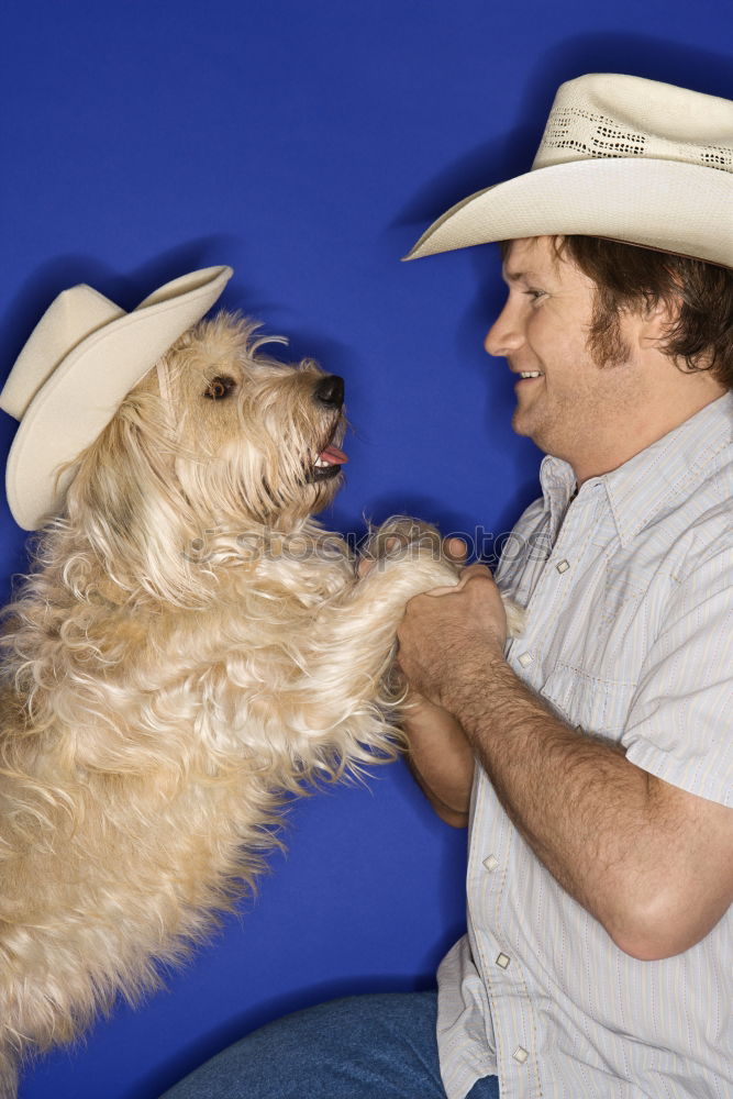 Similar – Image, Stock Photo Cute puppy licking face of young male adult