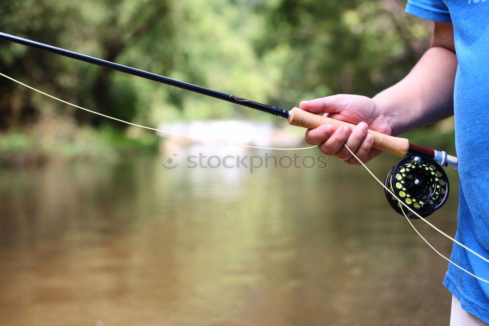 Similar – Man making mark by using pencil in garden