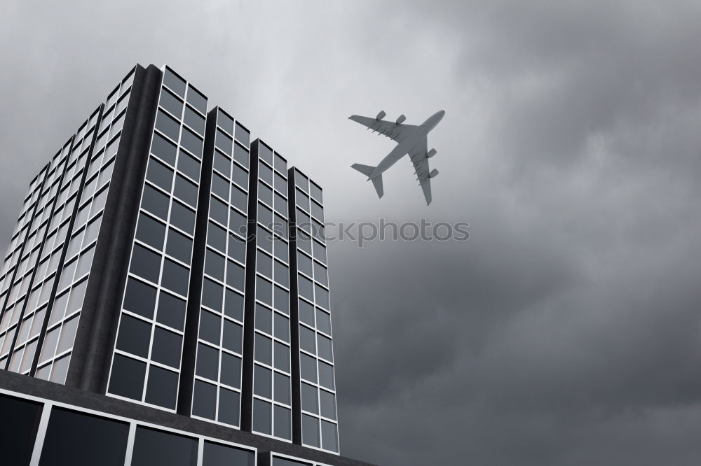 Similar – Plane flying over building