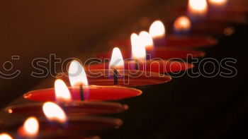 Similar – long lighted candles group in orthodox church. candles background. selective focus