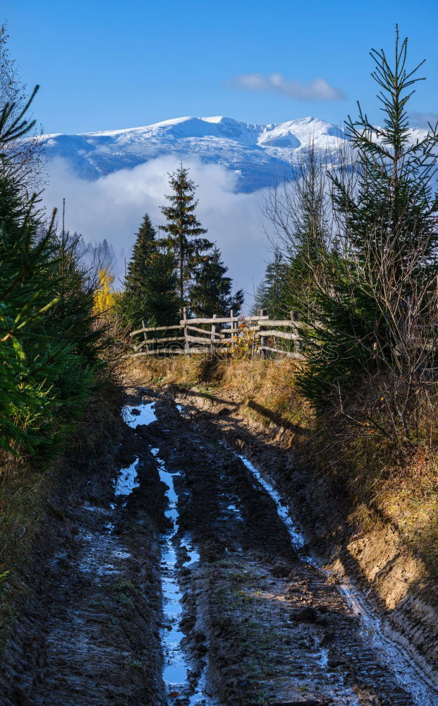 Similar – Landscape of snowy winter road with curves in the mountain