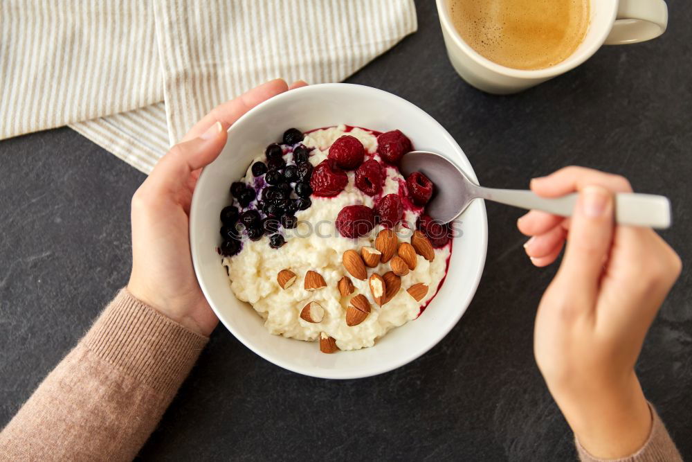 Similar – Image, Stock Photo Crop woman close up eating oat and fruits bowl for breakfast