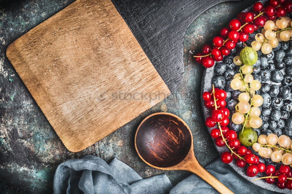 Similar – Background for recipes with different berries and cooking spoons