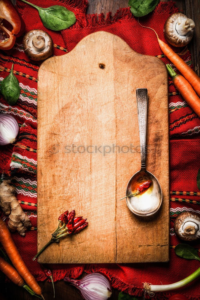 Similar – Image, Stock Photo Fresh vegetables around chopping board with cooking spoon