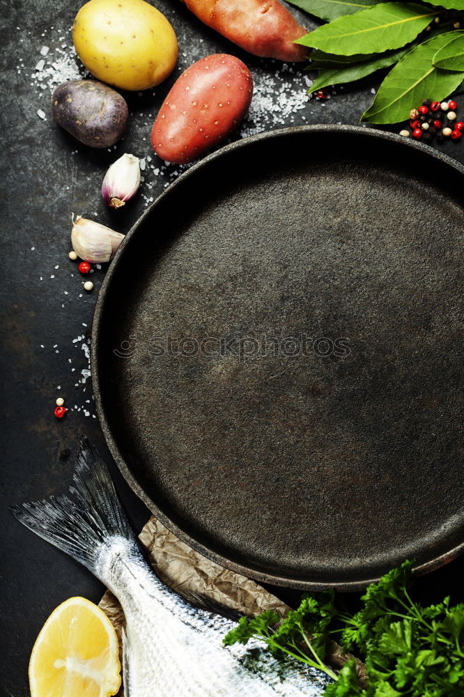 Similar – Image, Stock Photo Empty wok pan on kitchen table with chopsticks and vegetarian Asian food ingredients, top view. Copy space.  Healthy eating and cooking