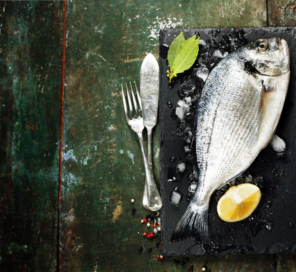 Similar – Fresh fish smelt spices for cooking on a kitchen board