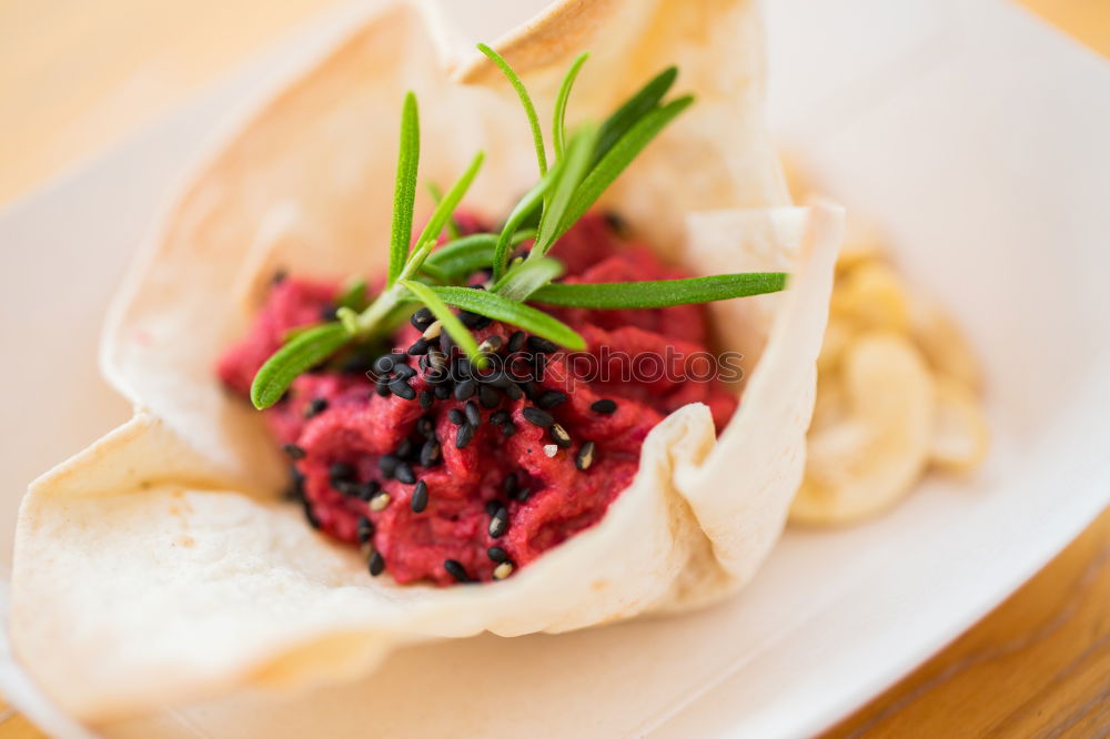 Similar – Mediterranean goat cheese baked in parchment paper