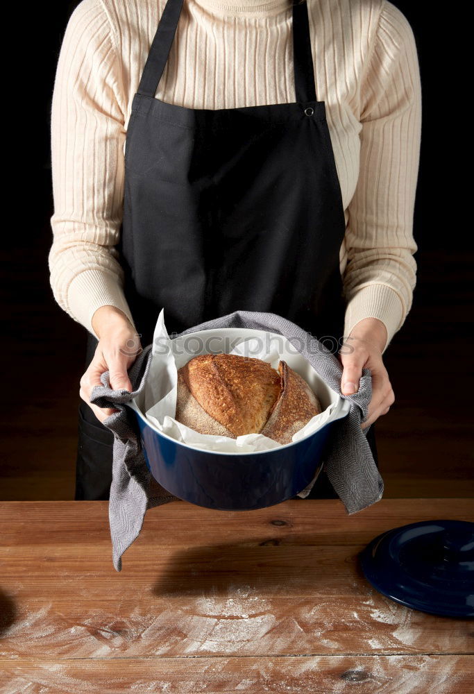 Similar – cook in red uniform holding an empty black frying pan