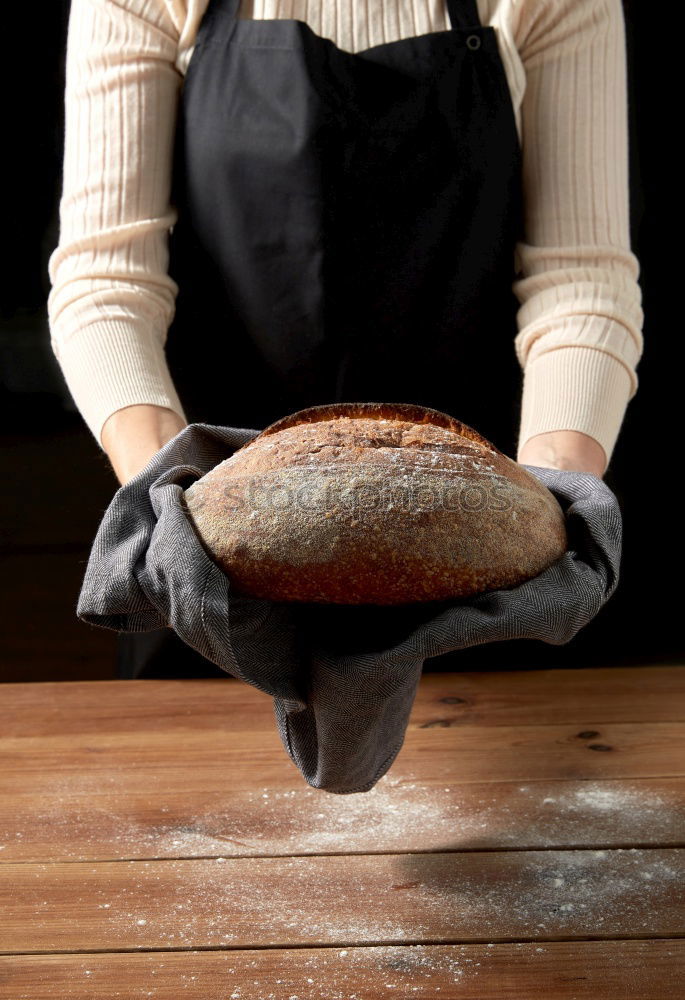 Similar – cook in red uniform holding an empty black frying pan