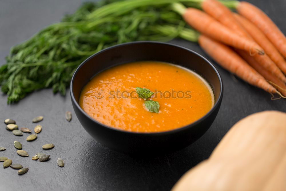 Similar – Fresh carrot juice in the iron mug on the kitchen table