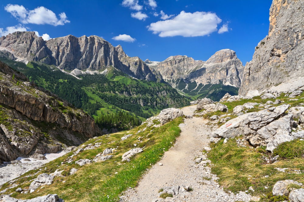 Similar – Hiking trail with hiker with panoramic view in the Dolomites