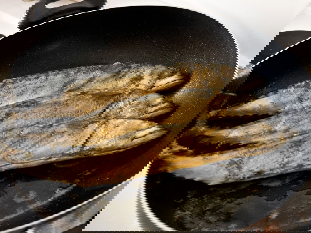 Similar – Image, Stock Photo Fried fish fillet on cast iron pan