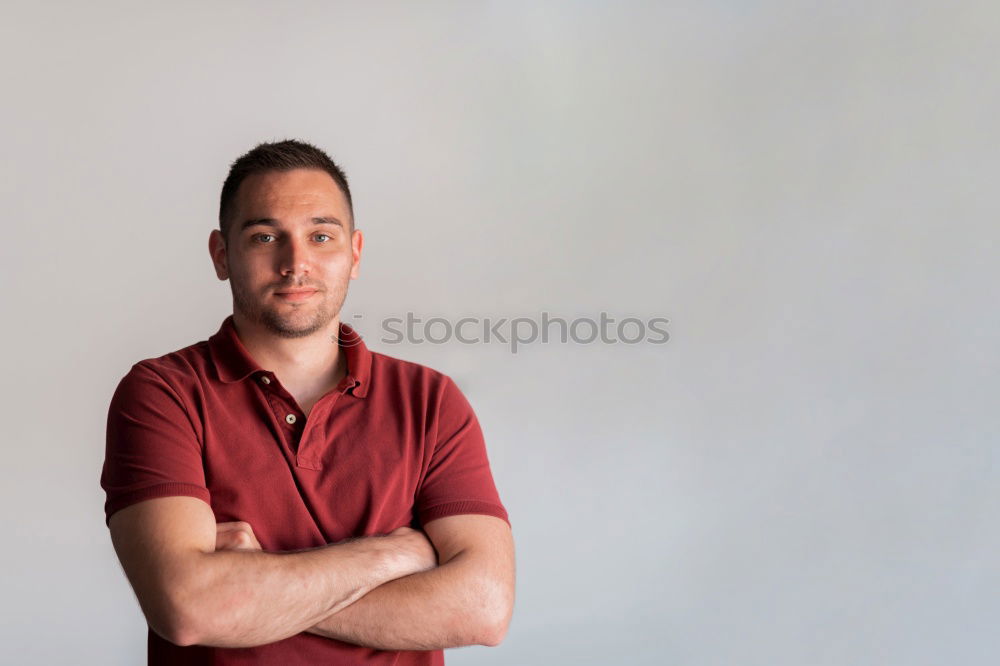 Similar – Image, Stock Photo young man looks into the camera, bookshelf in the background