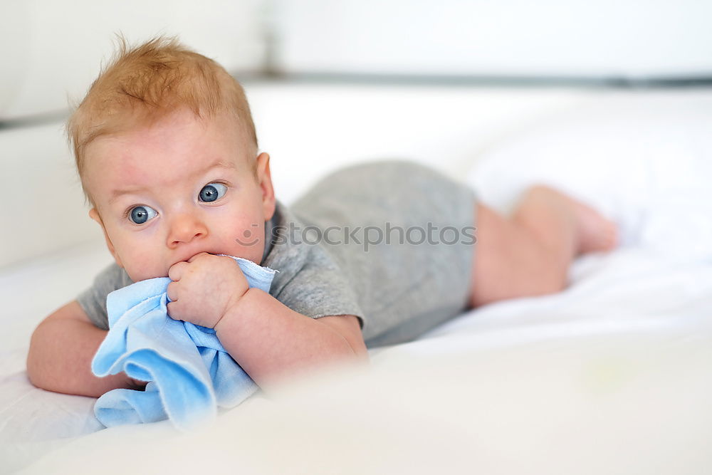 Similar – Cute Baby Girl Lying in the Crib.