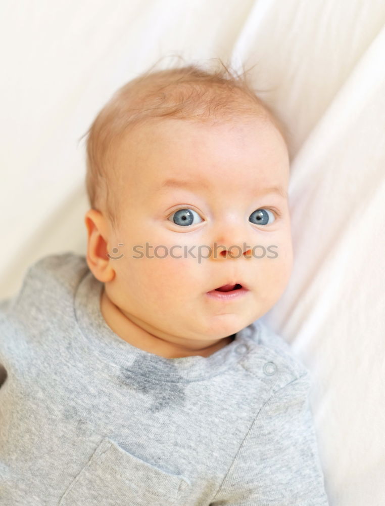 Similar – Image, Stock Photo mom dresses the baby on the bed