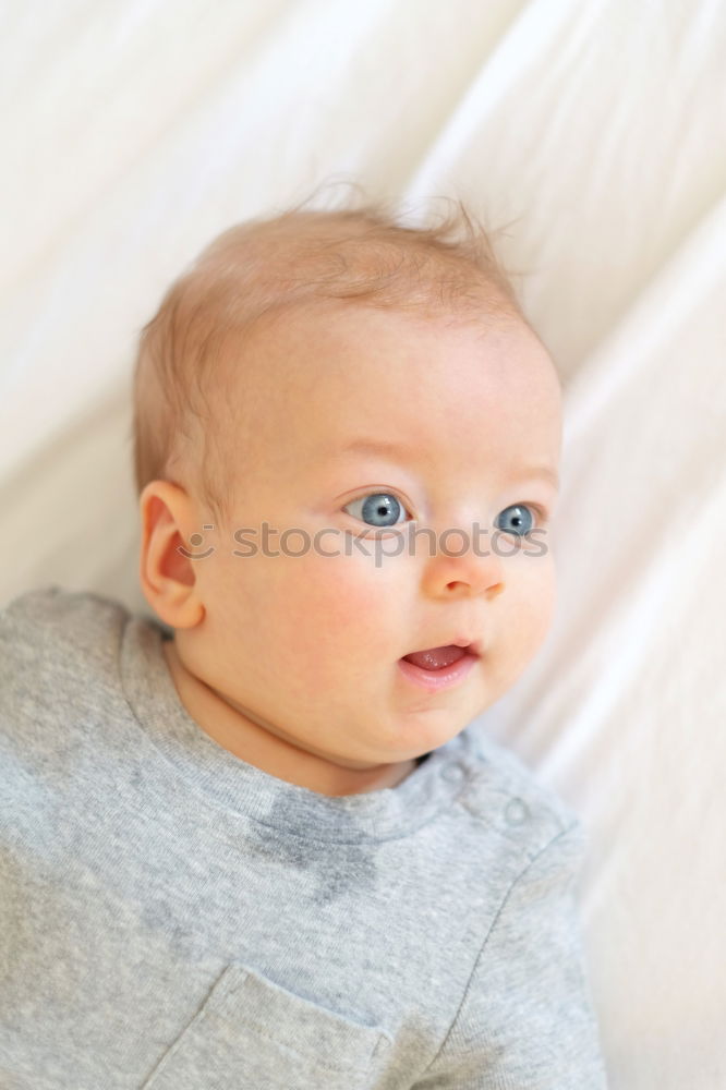 Similar – Image, Stock Photo mom dresses the baby on the bed