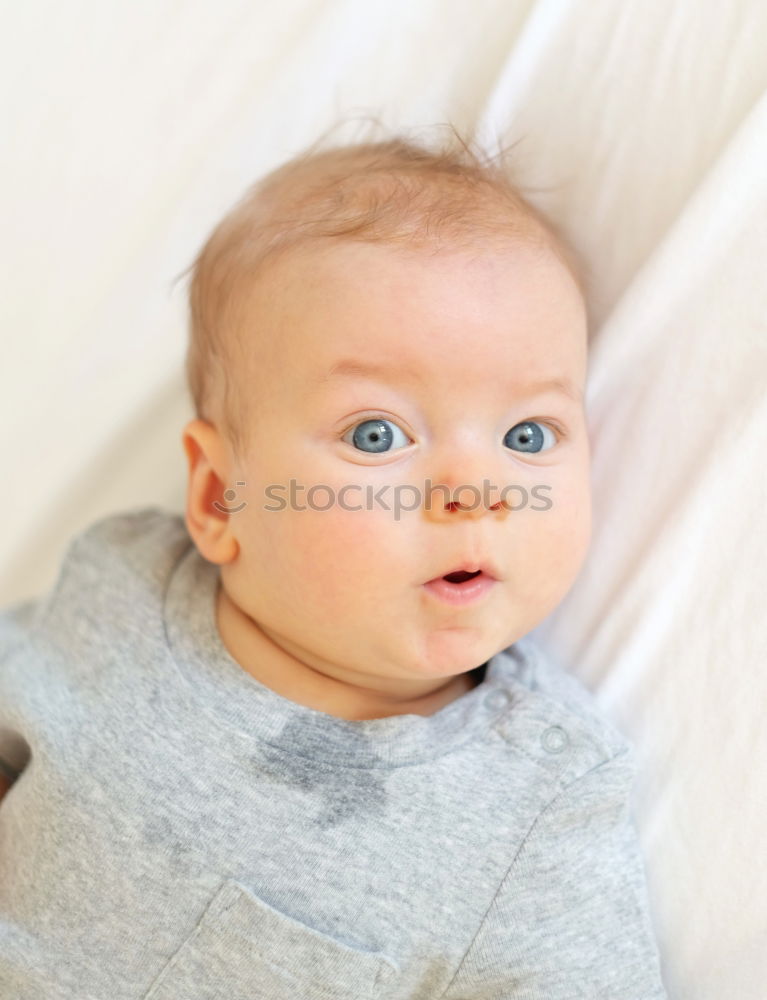 Similar – Image, Stock Photo mom dresses the baby on the bed