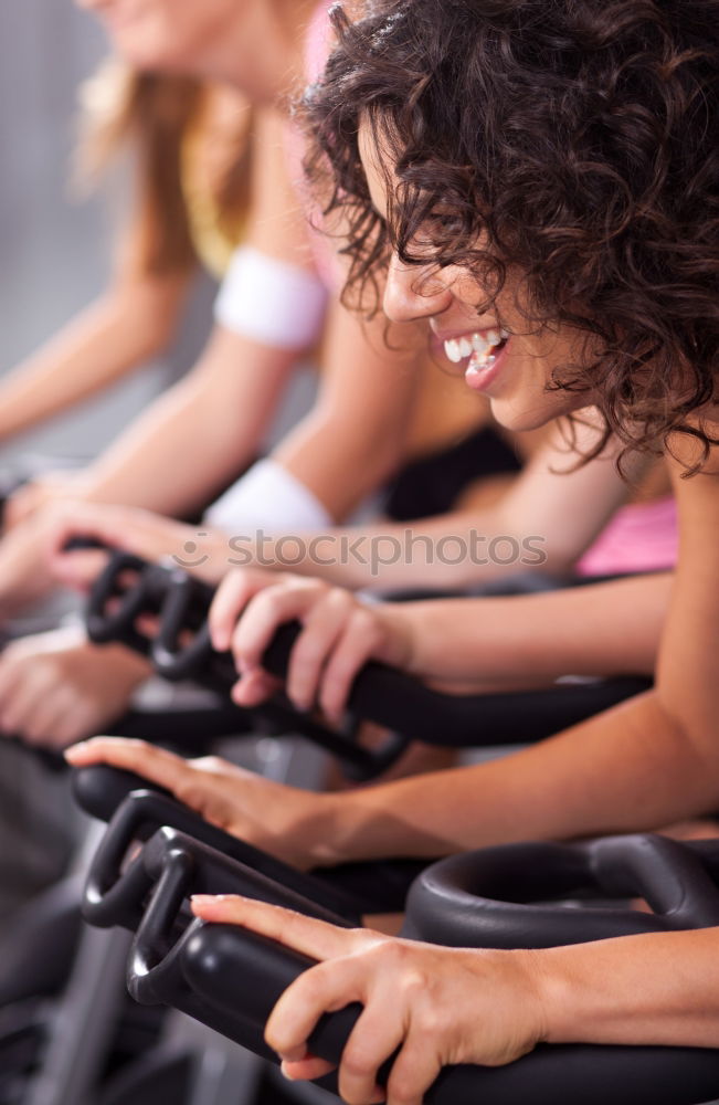 Similar – Concentrated woman in hard bike training session