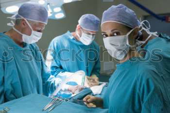 Similar – Image, Stock Photo Team of Surgeons Operating.