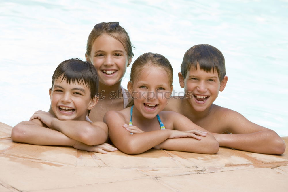 Similar – Image, Stock Photo Three happy children playing on the swimming pool at the day time. People having fun outdoors. Concept of friendly siblings.