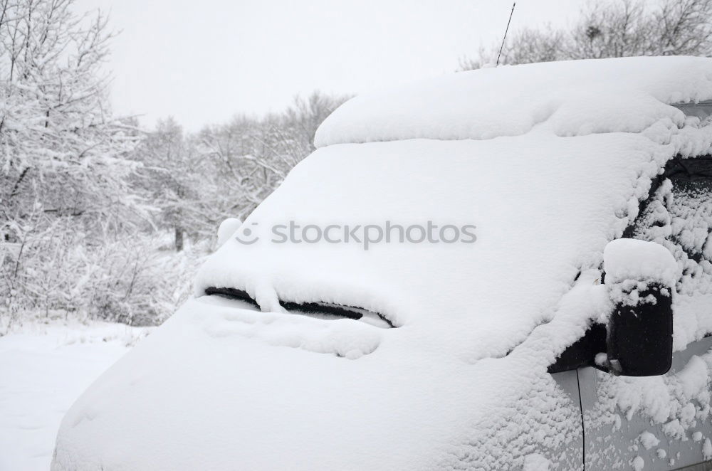 Similar – Image, Stock Photo 2 cut off windshield wipers sticking out of a car covered with snow