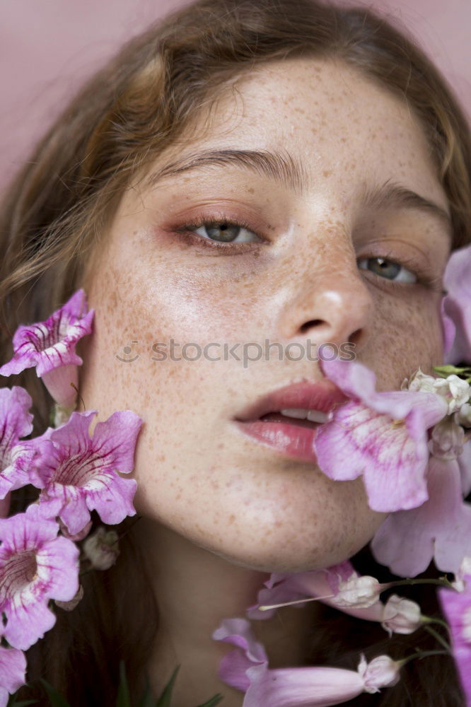 Similar – Image, Stock Photo Lifestyle portrait of happy young adult woman enjoying flowers