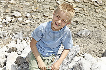Similar – Image, Stock Photo little boy points to the path where he has discovered something