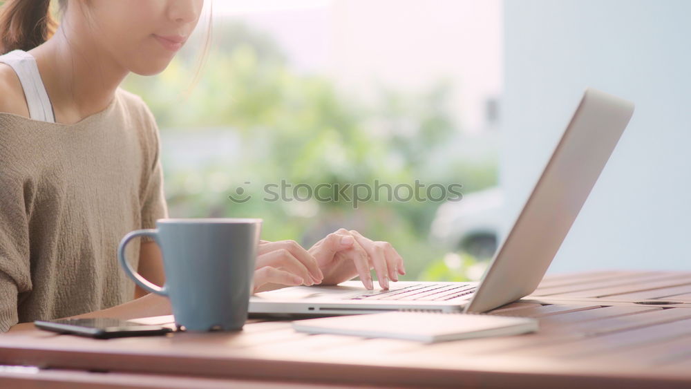 Similar – Woman measuring her own blood pressure at home.