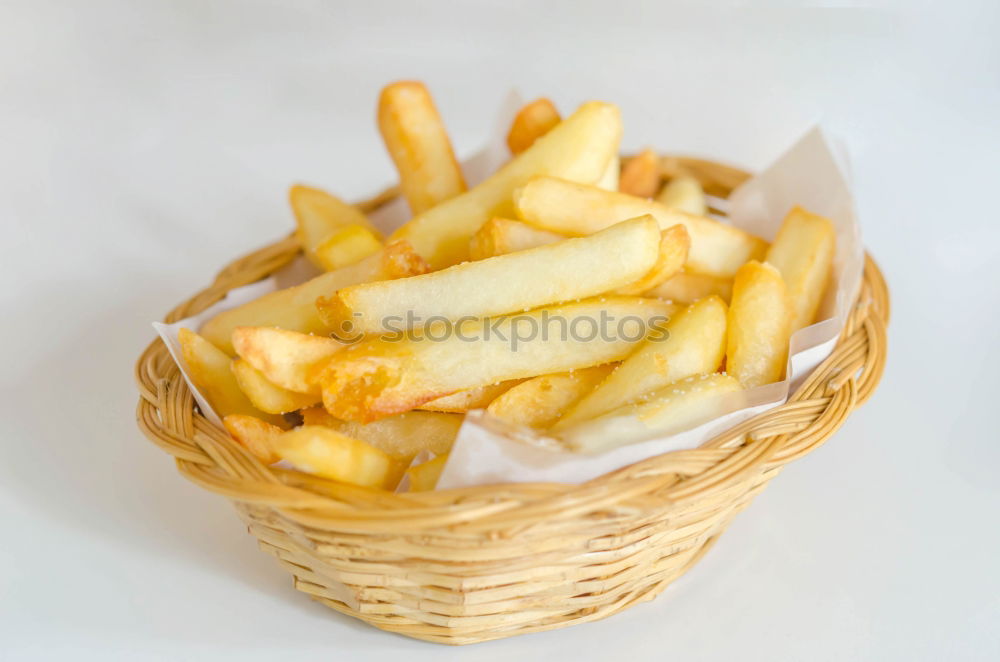 Similar – Foto Bild Portion Pommes mit Mayonnaise in einem Pappschälchen und einer Holzgabel auf einem Holztisch