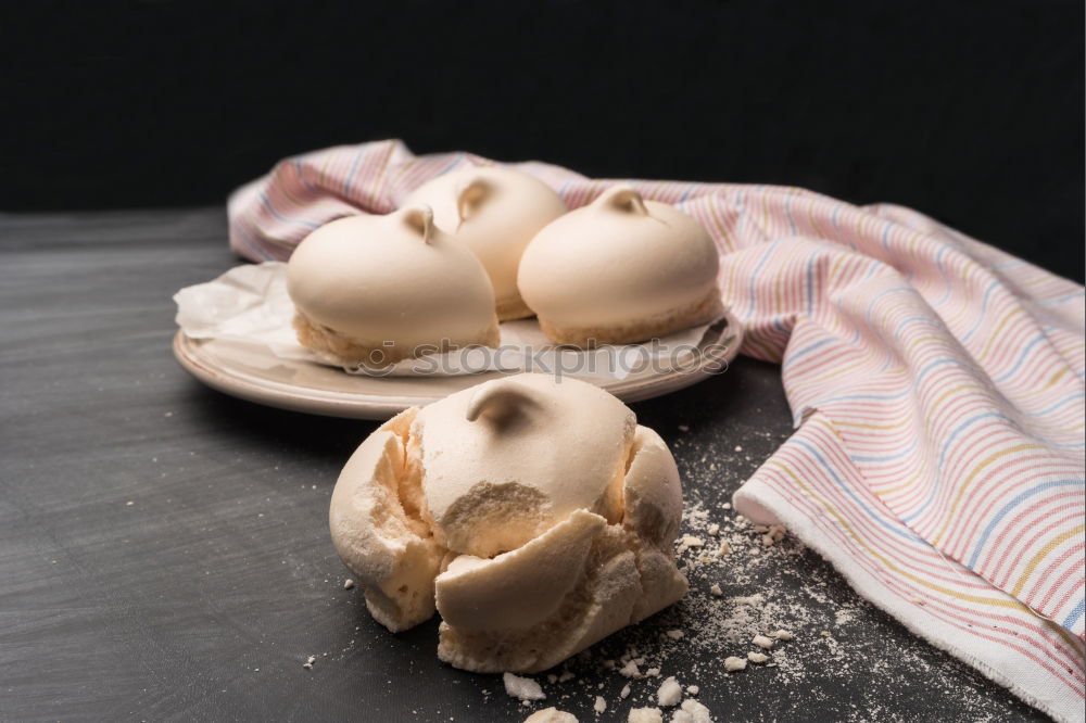 Similar – Meringue with cracks in old bowls