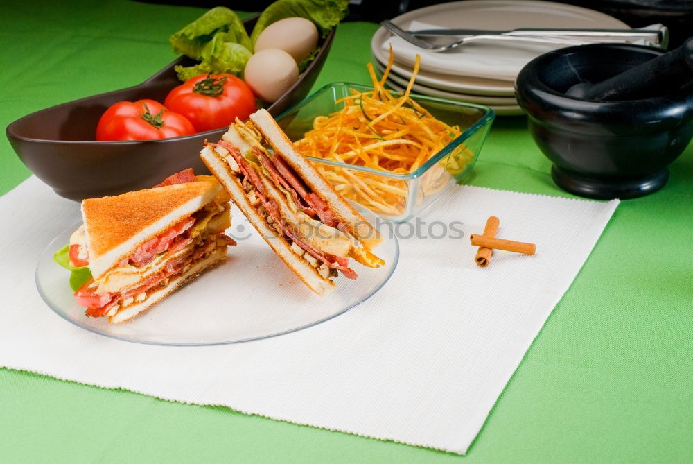 Similar – Homemade breakfast: bread with cheese, ham and lettuce, with app