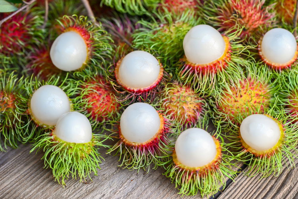 Similar – fresh tropical rambutan fruits over rustic wood table