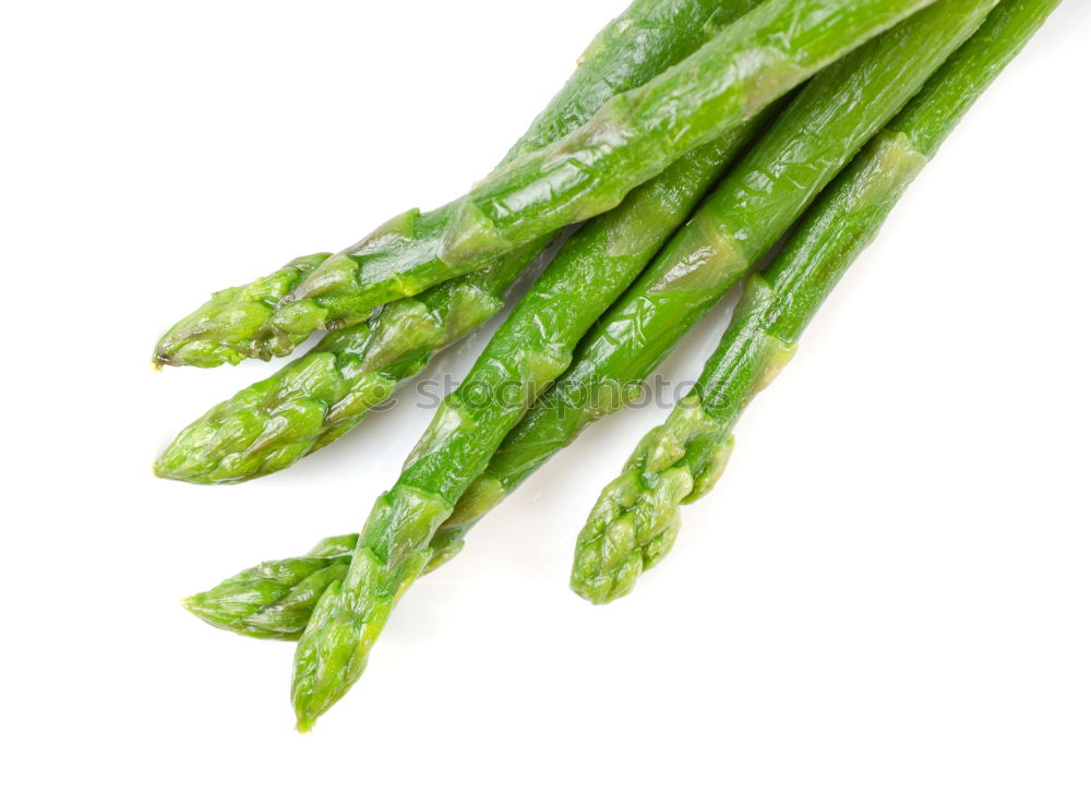 Similar – Image, Stock Photo Portion of asparagus bunch with green, fresh, juicy asparagus, from fresh, local harvest, lies in heaps, bundles on a white cloth made of linen.