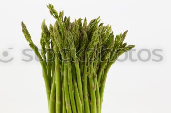 Similar – Image, Stock Photo Portion of asparagus bunch with green, fresh, juicy asparagus, from fresh, local harvest, lies in heaps, bundles on a white cloth made of linen.