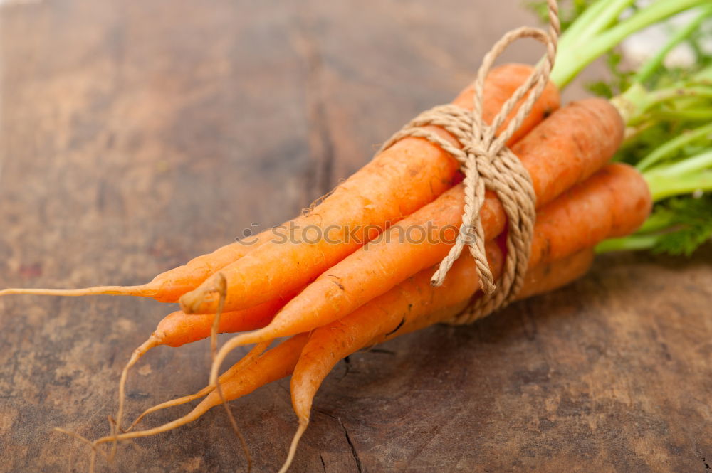 Similar – Image, Stock Photo Fresh raw carrots with leaves on a wooden table