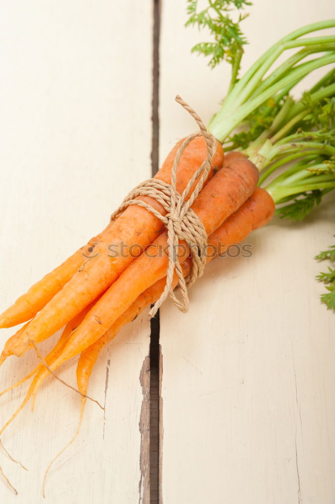 Similar – Image, Stock Photo Fresh raw carrots with leaves on a wooden table