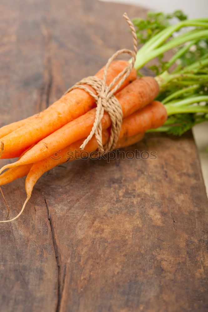 Similar – Image, Stock Photo Fresh raw carrots with leaves on a wooden table