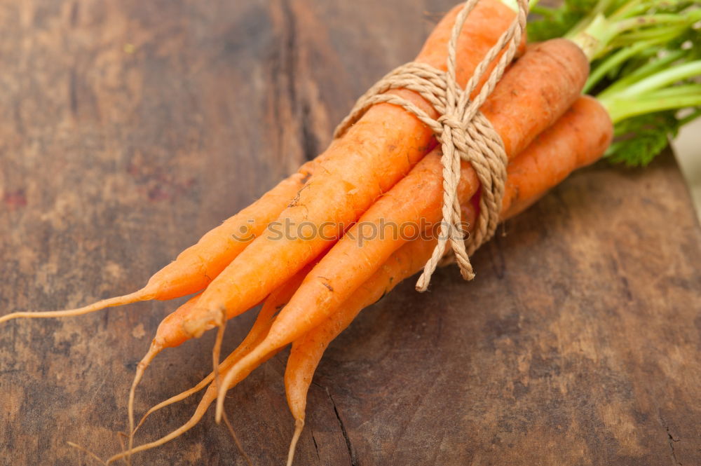 Similar – Image, Stock Photo Fresh raw carrots with leaves on a wooden table