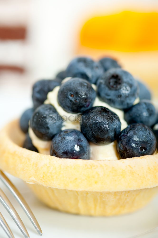 Similar – Delicious tartlets with raspberries and blueberries