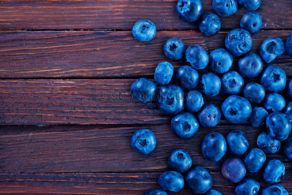 Similar – Image, Stock Photo Freshly gathered blueberries put into ceramic bowl