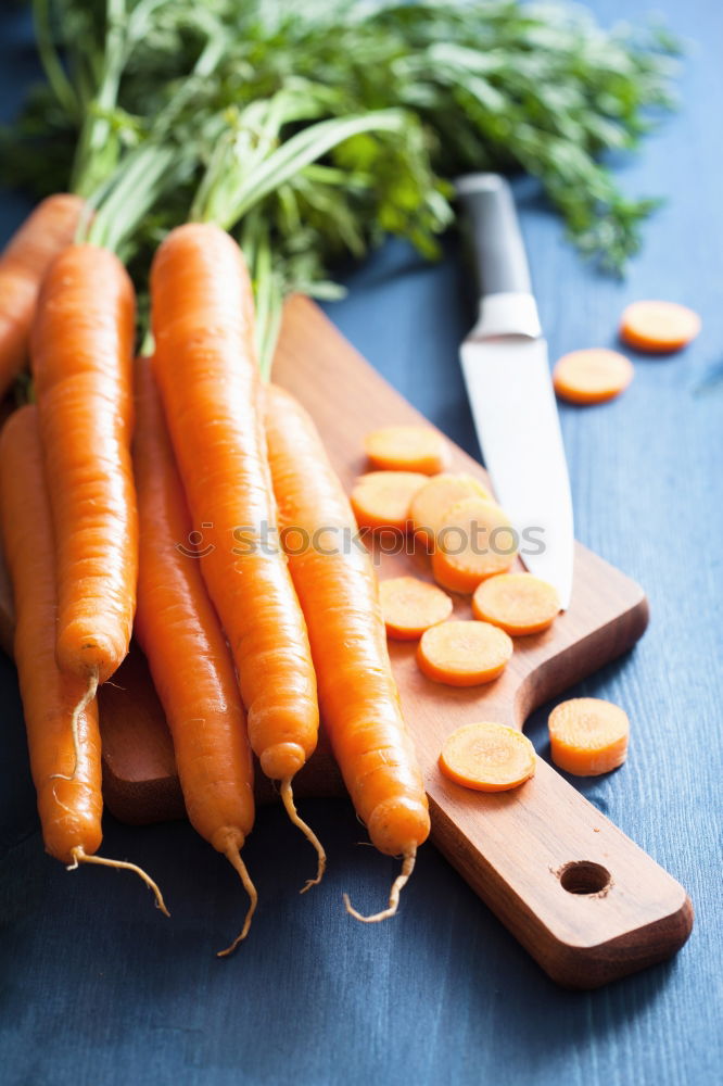 Similar – Sliced carrots on a chopping board