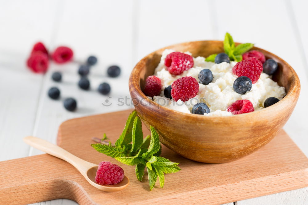 Similar – Oat flakes with milk and berries