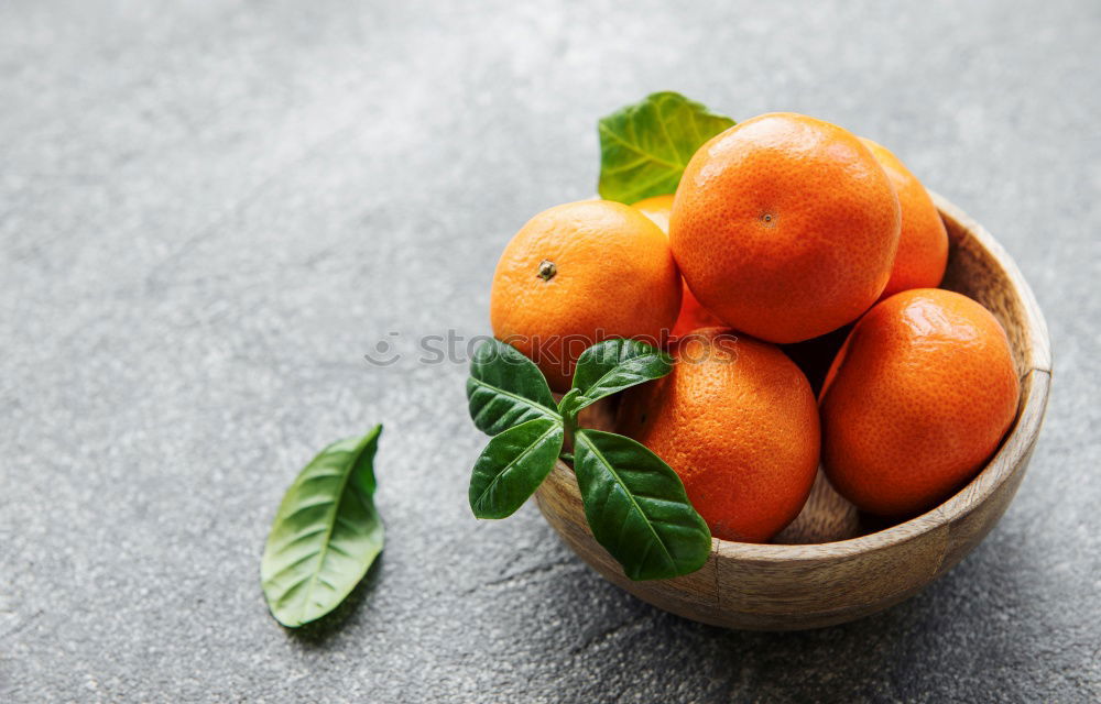 Similar – Image, Stock Photo Tangerines with green leaves in the blue bowl