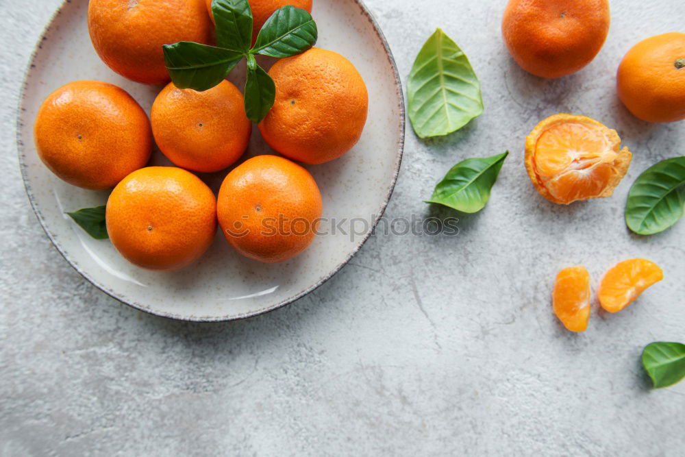 Similar – Image, Stock Photo Tangerines with green leaves in the blue bowl