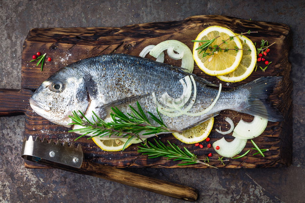 Similar – Image, Stock Photo Fresh fish smelt for cooking on a kitchen board