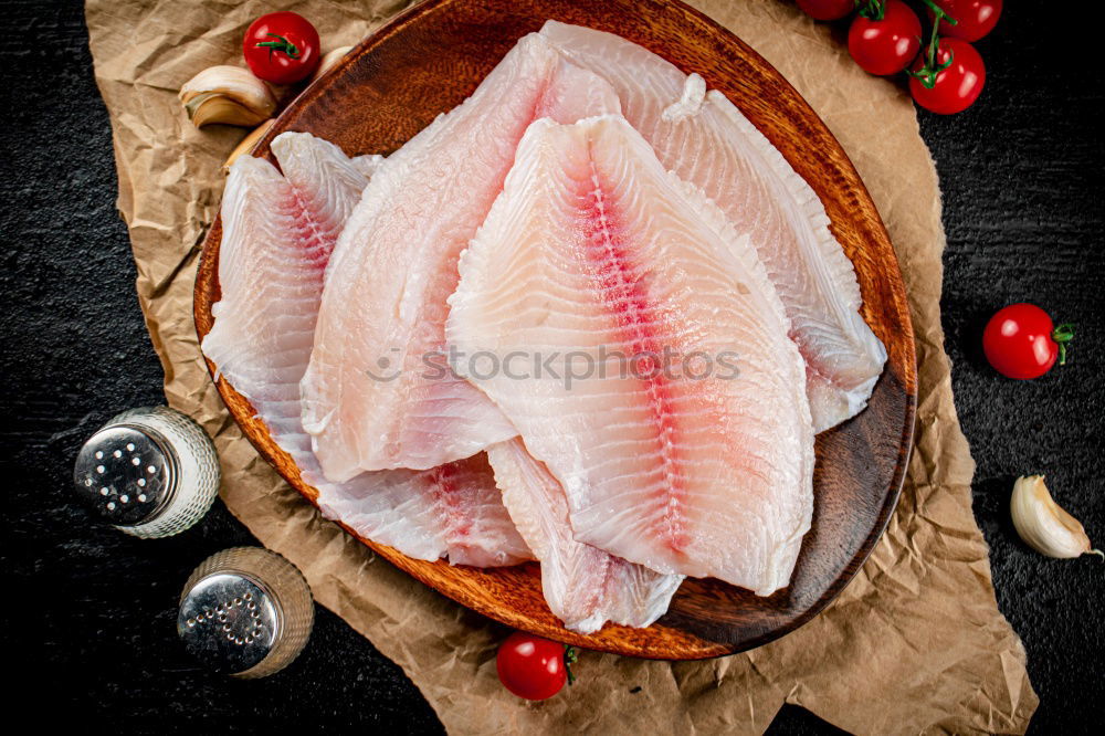 Fish fillet preparation on the baking tray