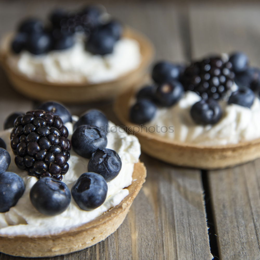 Similar – Delicious tartlets with raspberries and blueberries