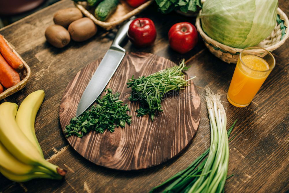 Similar – Vegetables and utensils on kitchen table