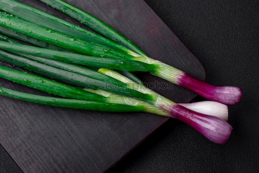 Similar – Zucchini with flowers on a dark background top view