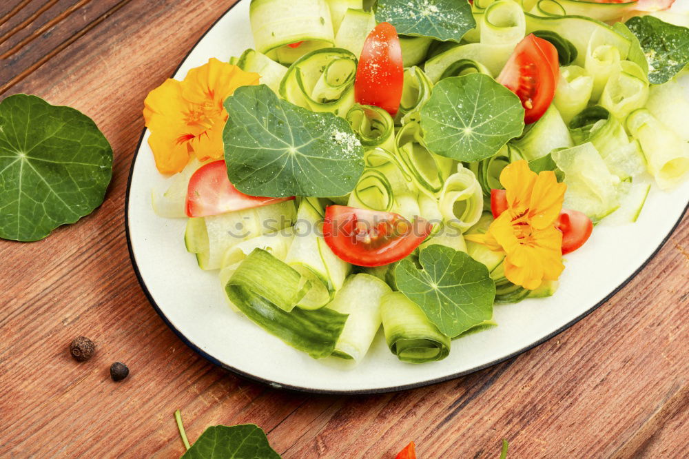 Similar – Image, Stock Photo Fresh vegan salad with edible flowers